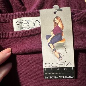 Sophia sweater dress.  The color is cranberry but it’s showing purple. New w/tag